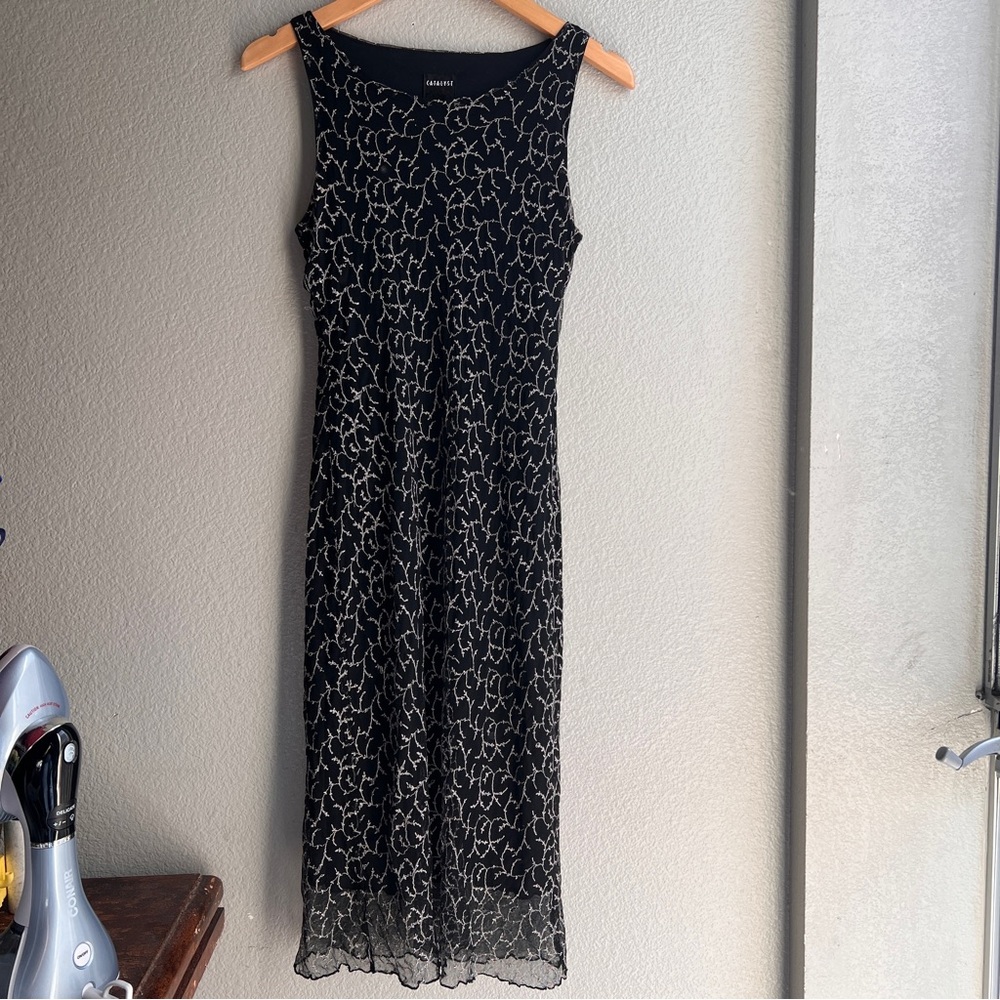CATALYST New York long sleeveless black dress with a floral design. S